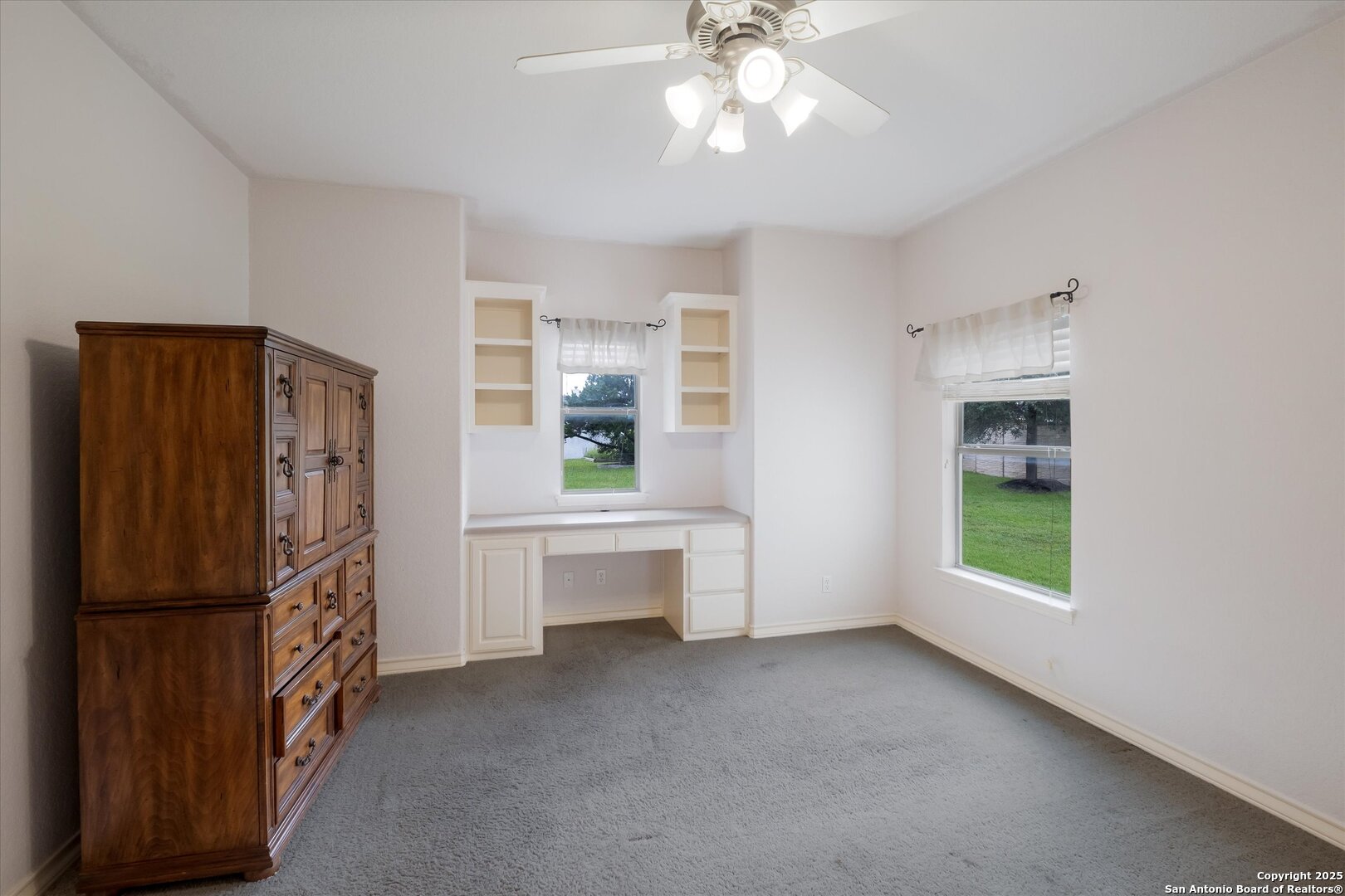 611 Ridge San Antonio, TX 78258 - Photo 25 of 42 a view of an empty room with a window and kitchen view