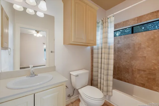 a view of an empty room with a kitchen