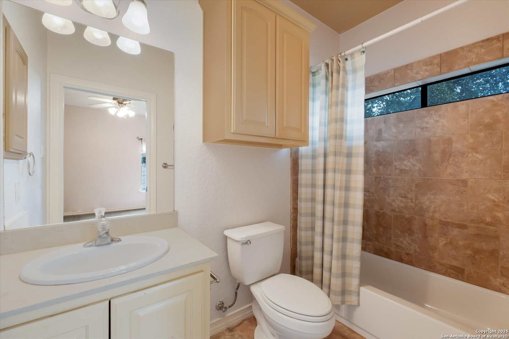 611 Ridge San Antonio, TX 78258 - Photo 26 of 42 a bathroom with a sink a toilet and shower