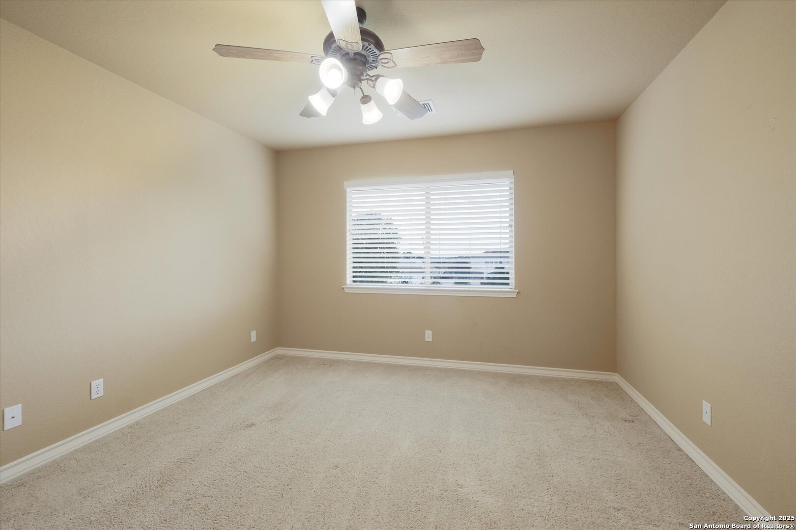 611 Ridge San Antonio, TX 78258 - Photo 30 of 42 an empty room with windows and fan