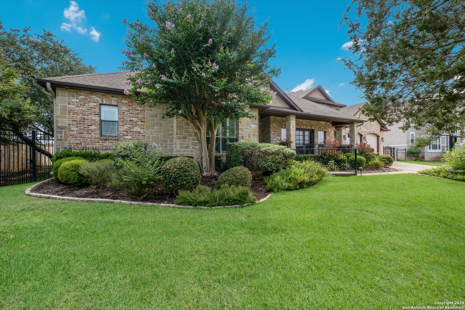 611 Ridge San Antonio, TX 78258 - Photo 3 of 42 a front view of a house with a garden