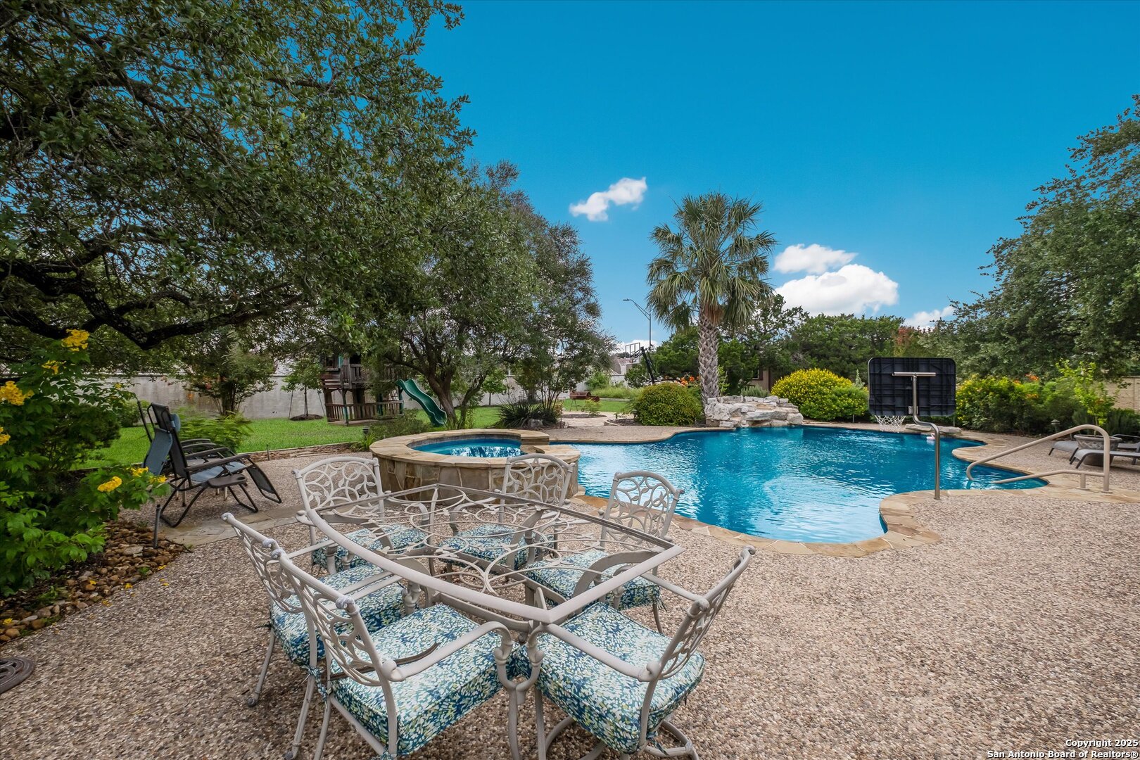 611 Ridge San Antonio, TX 78258 - Photo 37 of 42 a view of a patio with table and chairs potted plants and large tree