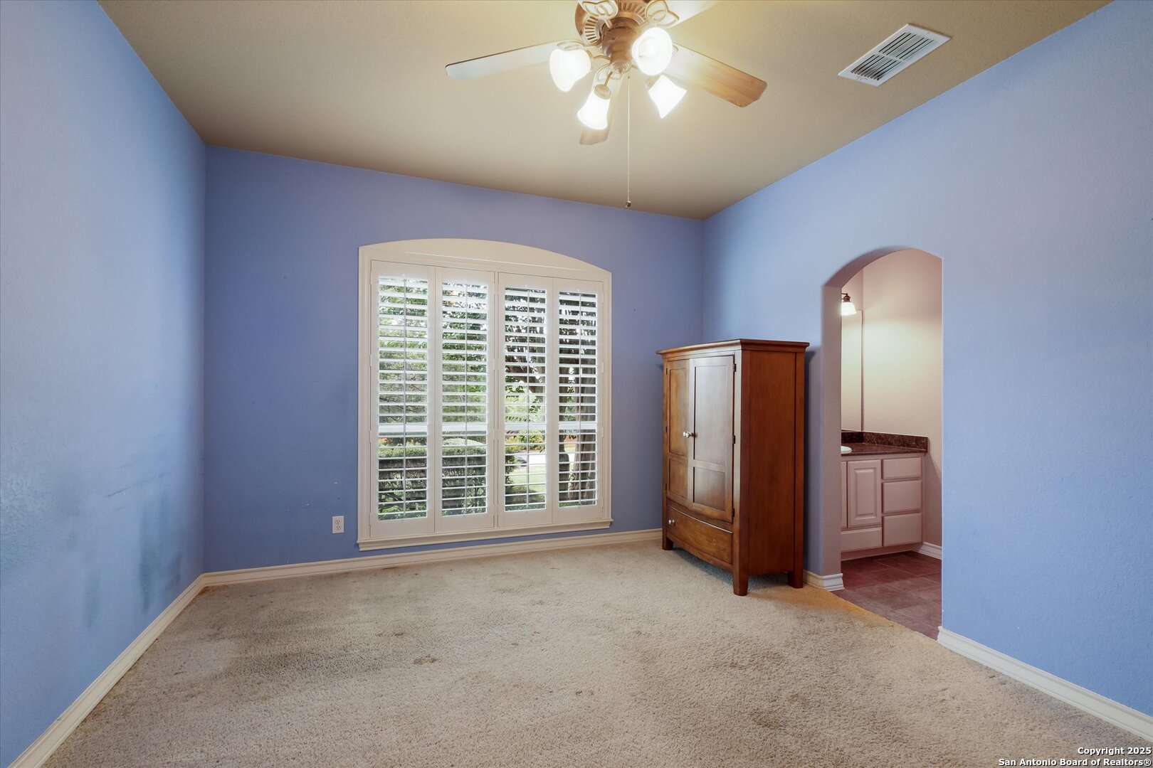 611 Ridge San Antonio, TX 78258 - Photo 5 of 42 an empty room with a window and chandelier