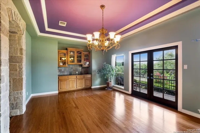 a kitchen with kitchen island stainless steel appliances a stove a sink a counter space and cabinets