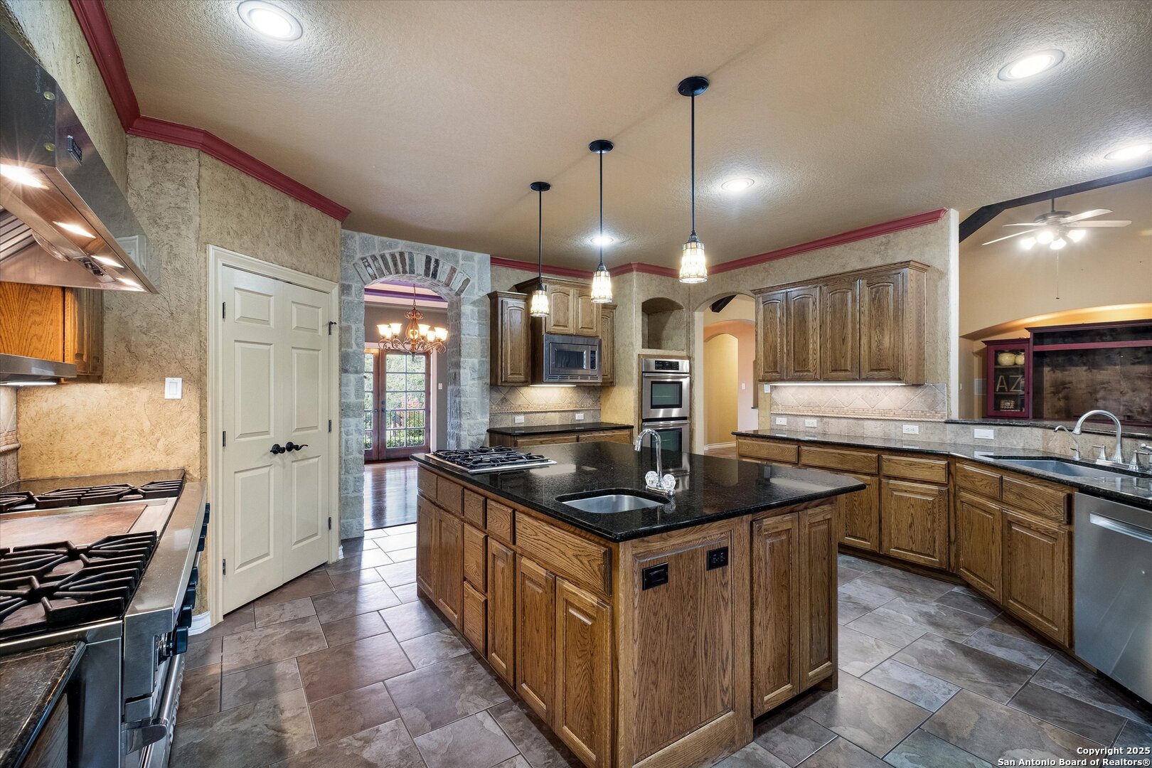 611 Ridge San Antonio, TX 78258 - Photo 10 of 42 a kitchen with stainless steel appliances granite countertop a stove and a sink