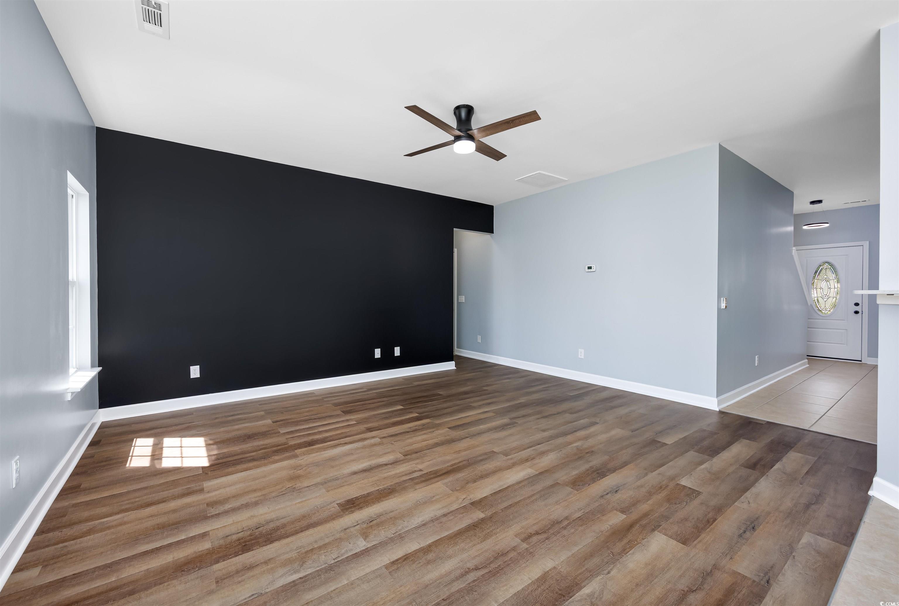 1031 Snowberry Drive Longs, SC 29568 - Photo 14 of 38 Unfurnished room featuring light wood-type flooring and ceiling fan