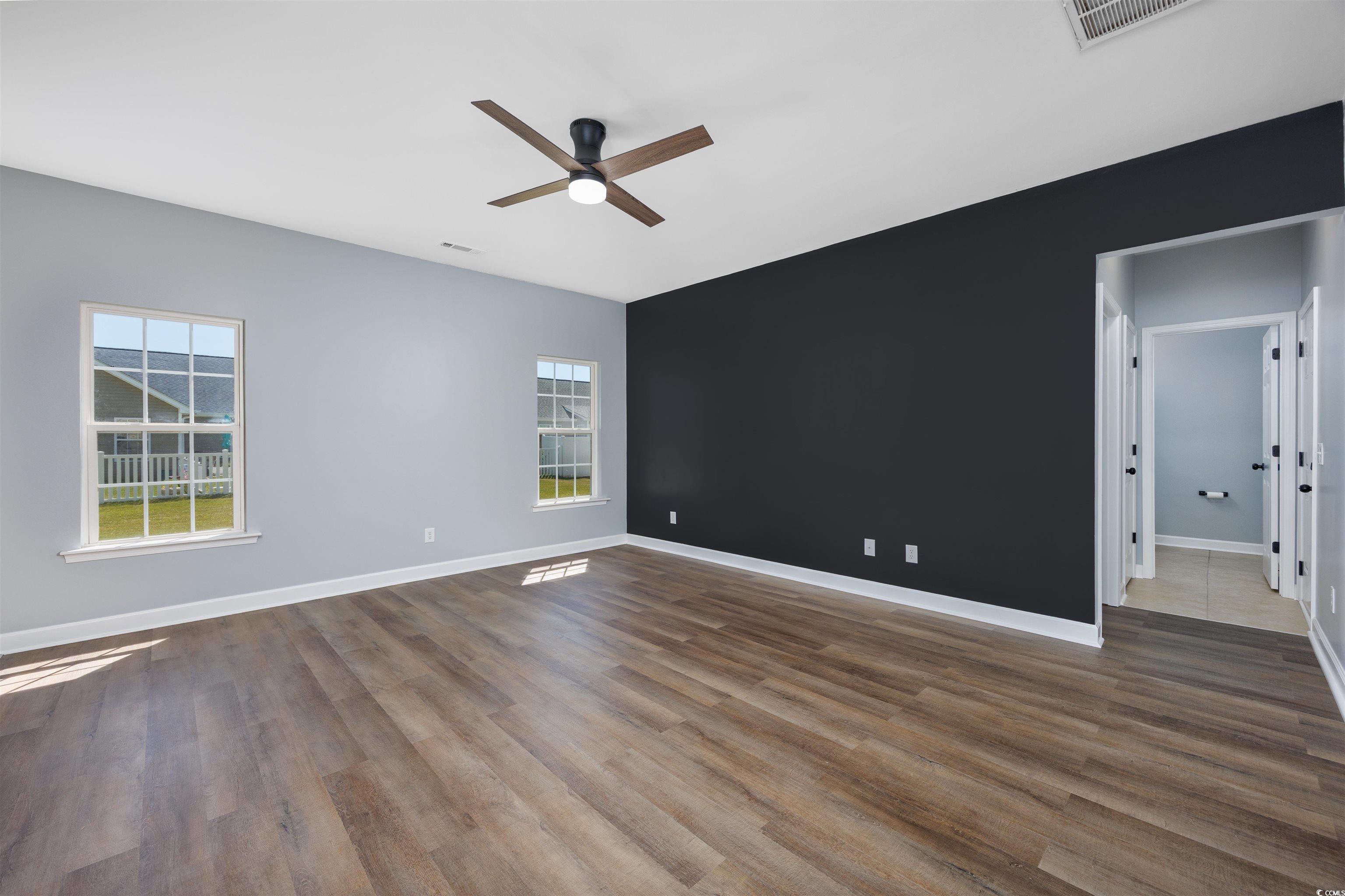 1031 Snowberry Drive Longs, SC 29568 - Photo 15 of 38 Empty room featuring wood finished floors and a ceiling fan