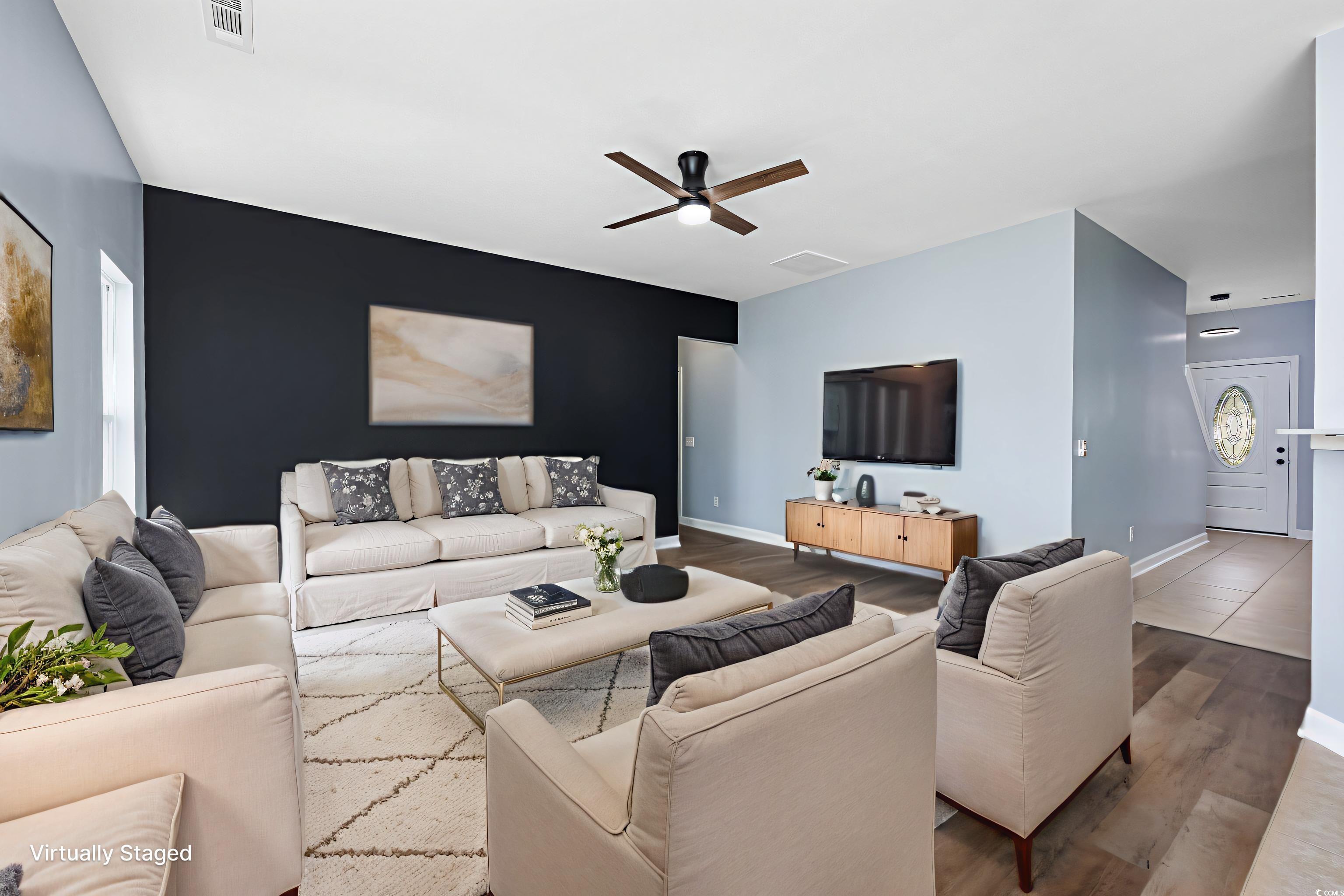 1031 Snowberry Drive Longs, SC 29568 - Photo 16 of 38 Living room with wood finished floors and a ceiling fan