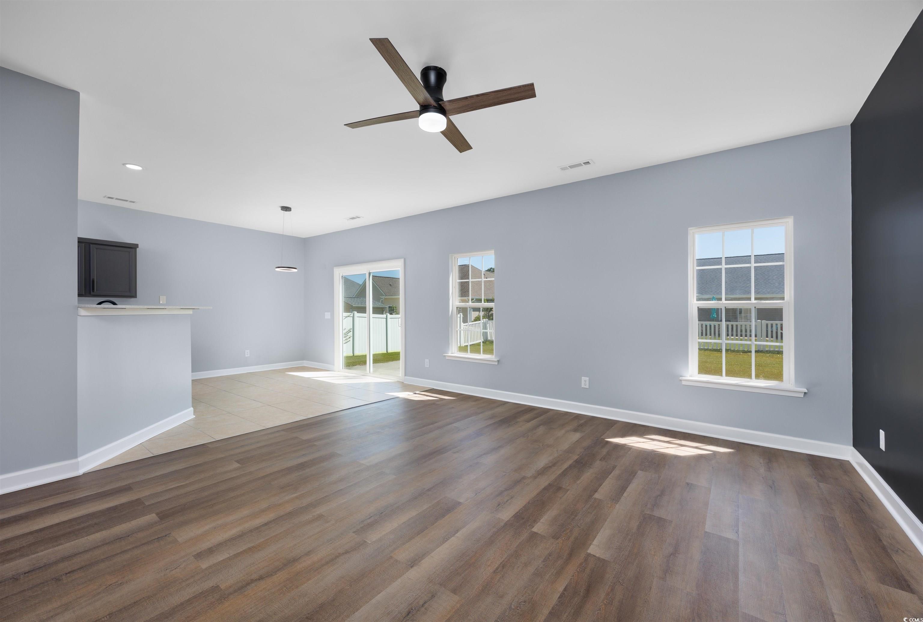 1031 Snowberry Drive Longs, SC 29568 - Photo 17 of 38 Unfurnished living room featuring light wood-style floors and ceiling fan