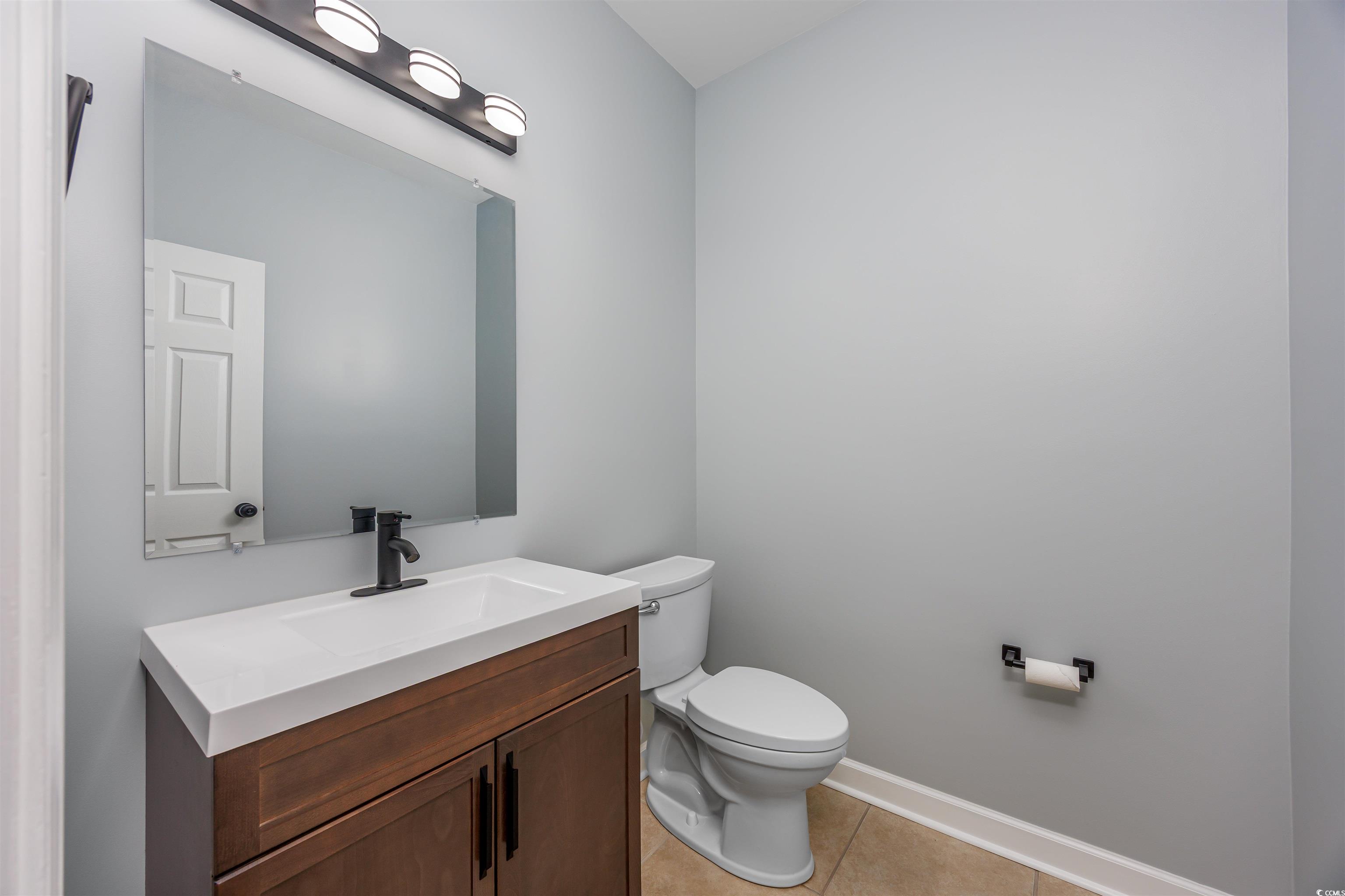 1031 Snowberry Drive Longs, SC 29568 - Photo 20 of 38 Bathroom with vanity and light tile patterned flooring