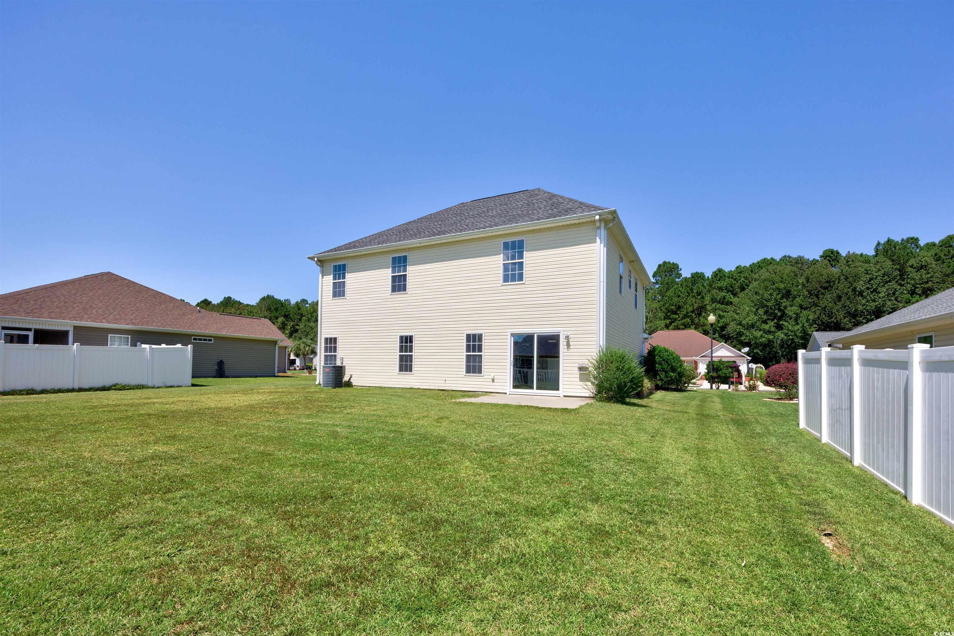 1031 Snowberry Drive Longs, SC 29568 - Photo 3 of 38 Rear view of property with a patio