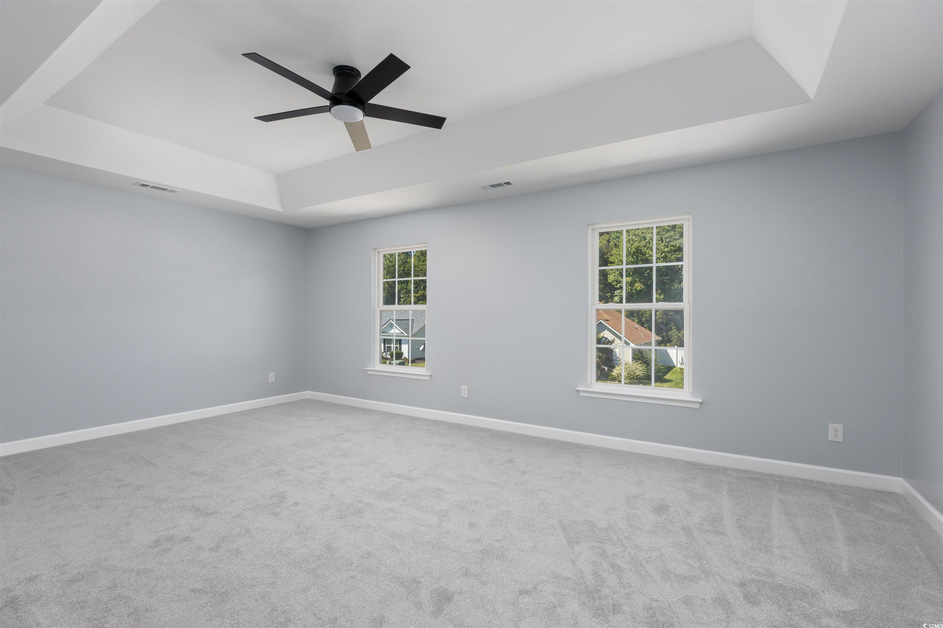 1031 Snowberry Drive Longs, SC 29568 - Photo 31 of 38 Unfurnished room featuring a raised ceiling, light colored carpet, and a ceiling fan