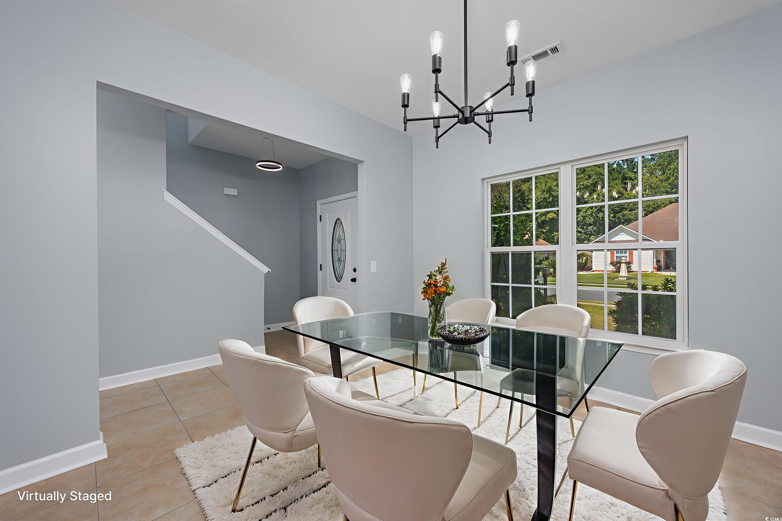 1031 Snowberry Drive Longs, SC 29568 - Photo 7 of 38 Dining room with light tile patterned flooring and a chandelier