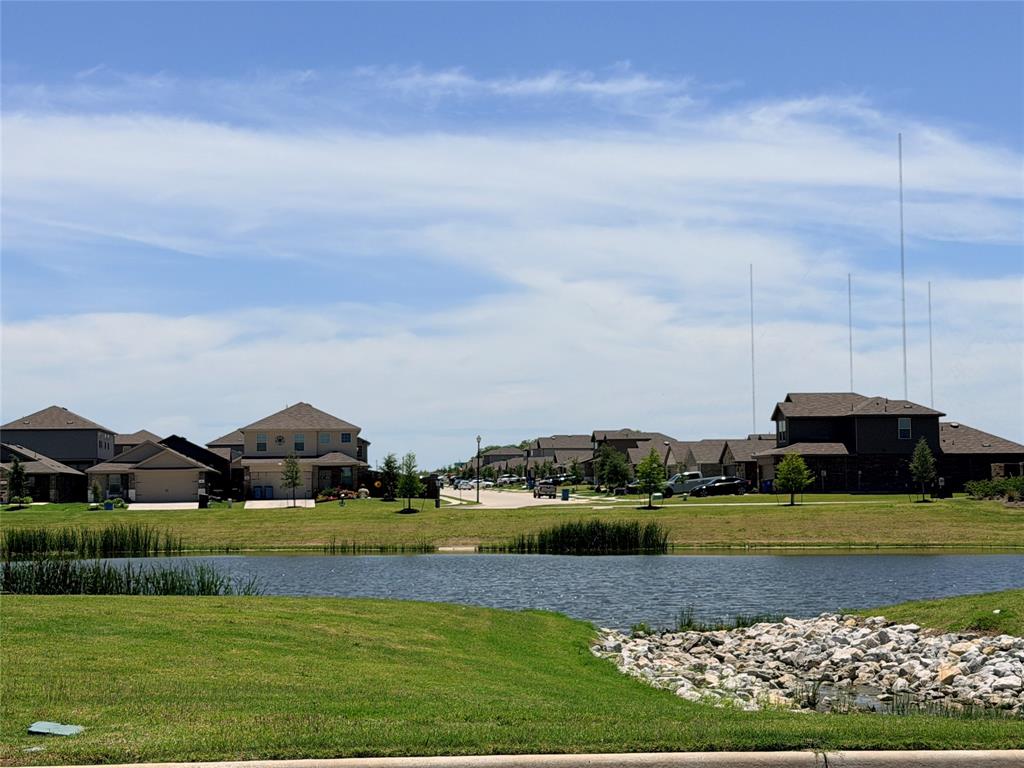 816 Country Road Royse City, TX 75189 - Photo 17 of 24 Pond with surrounding green space, featuring manicured lawns and scattered trees