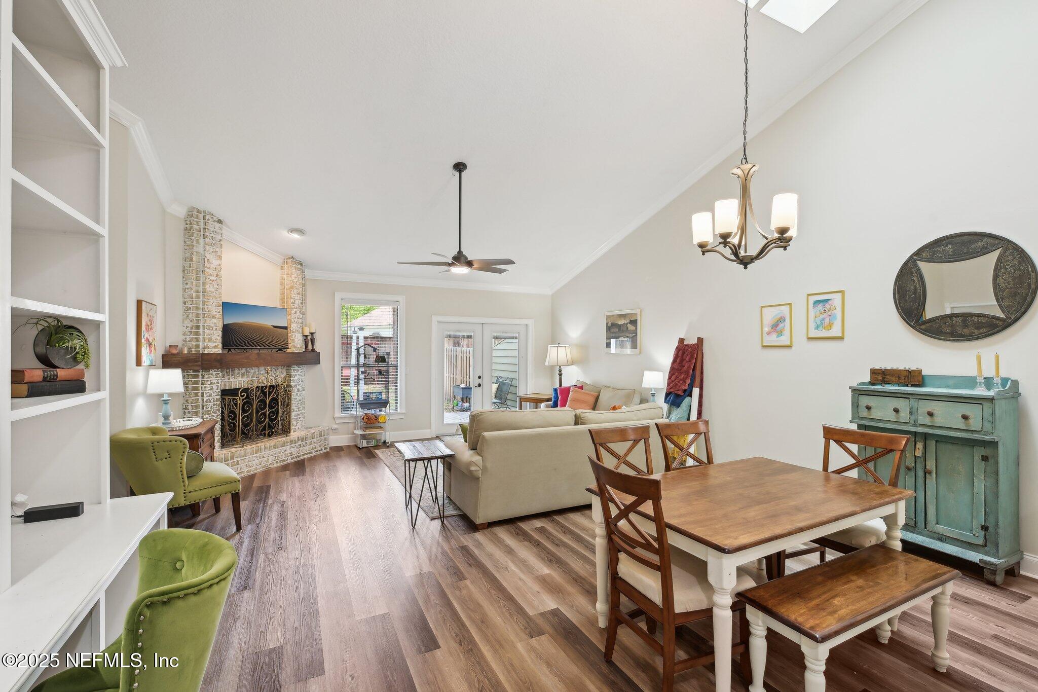 585 Pine Forest Trail Orange Park, FL 32073 - Photo 17 of 52 a living room with fireplace furniture and a wooden floor