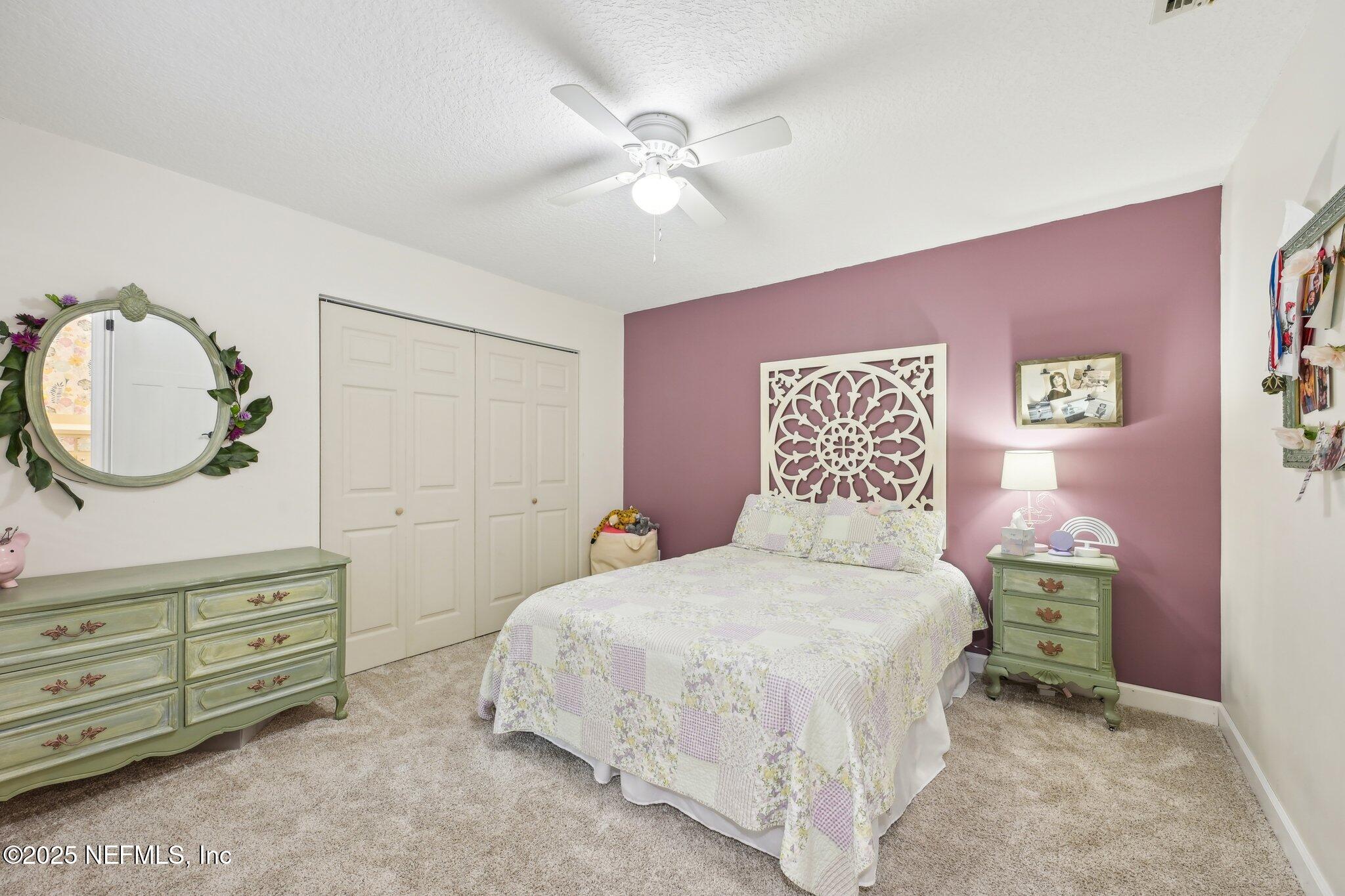 585 Pine Forest Trail Orange Park, FL 32073 - Photo 22 of 52 a bedroom with a bed and a dresser