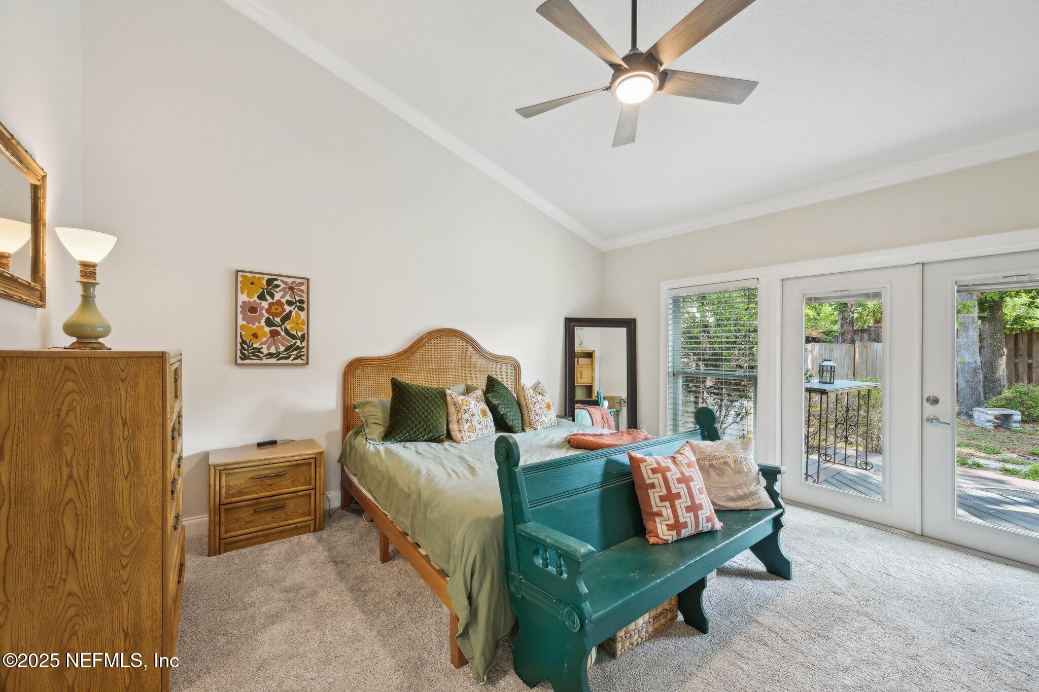 585 Pine Forest Trail Orange Park, FL 32073 - Photo 27 of 52 a bedroom with a bed and a couch