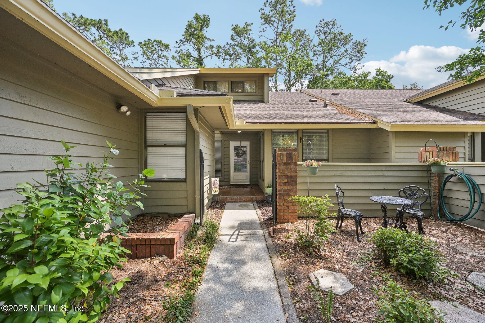 585 Pine Forest Trail Orange Park, FL 32073 - Photo 3 of 52 a front view of a house with garden