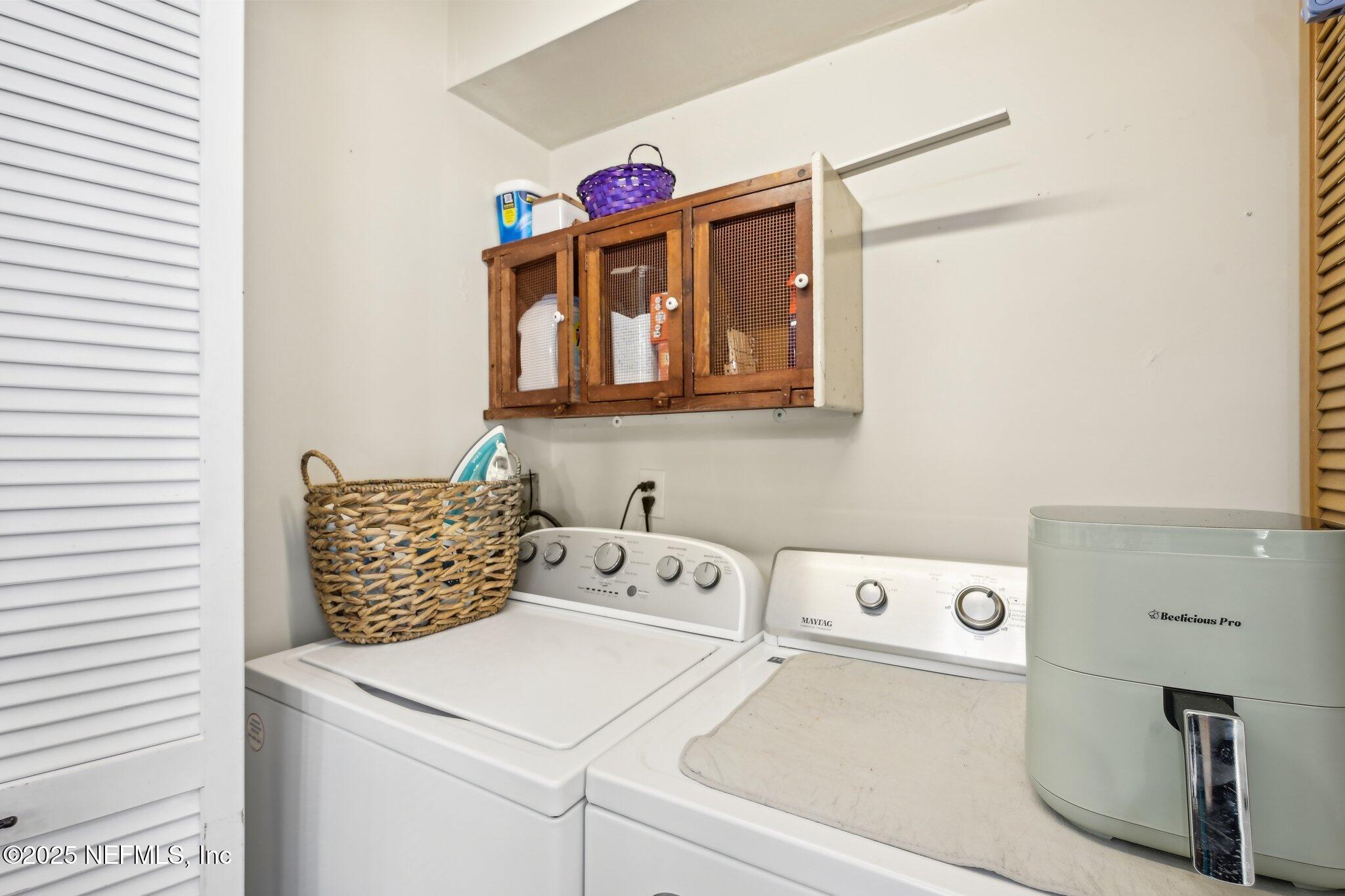 585 Pine Forest Trail Orange Park, FL 32073 - Photo 33 of 52 a utility room with dryer and washer
