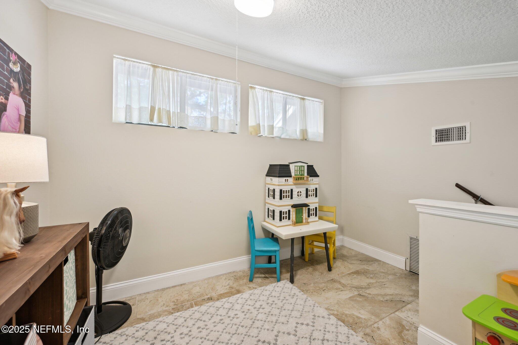 585 Pine Forest Trail Orange Park, FL 32073 - Photo 36 of 52 a view of a workspace with furniture and a window
