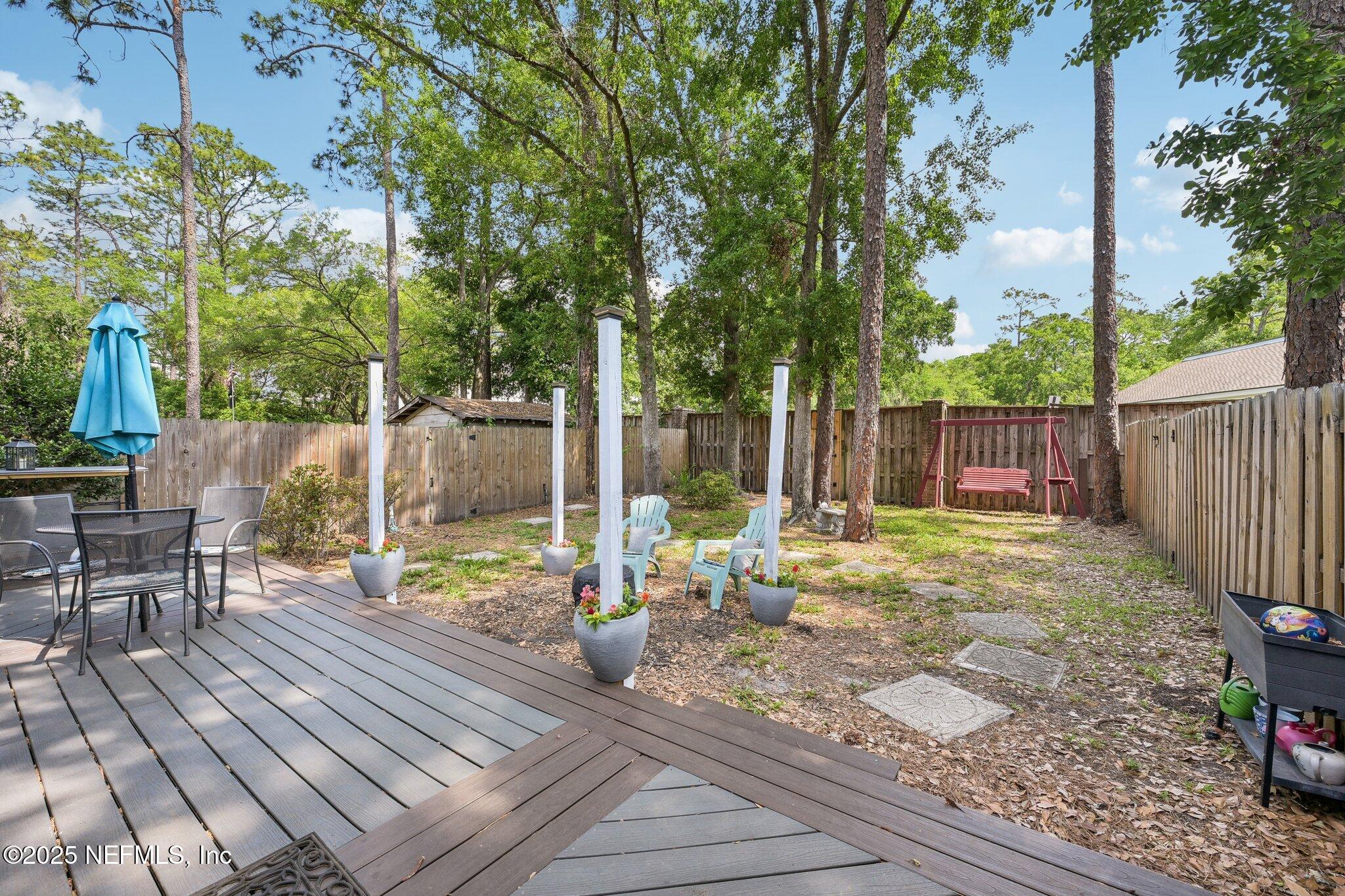 585 Pine Forest Trail Orange Park, FL 32073 - Photo 38 of 52 a view of a backyard with a patio