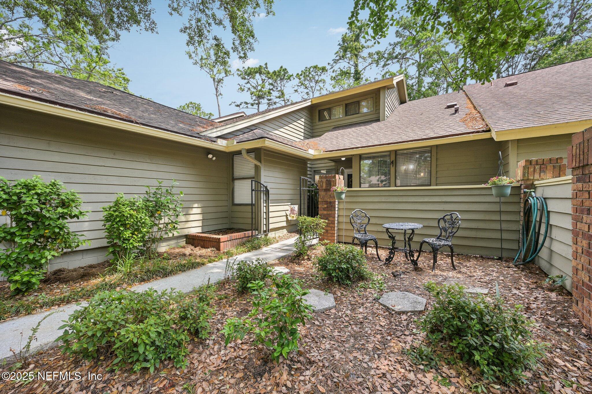 585 Pine Forest Trail Orange Park, FL 32073 - Photo 4 of 52 a front view of a house with garden