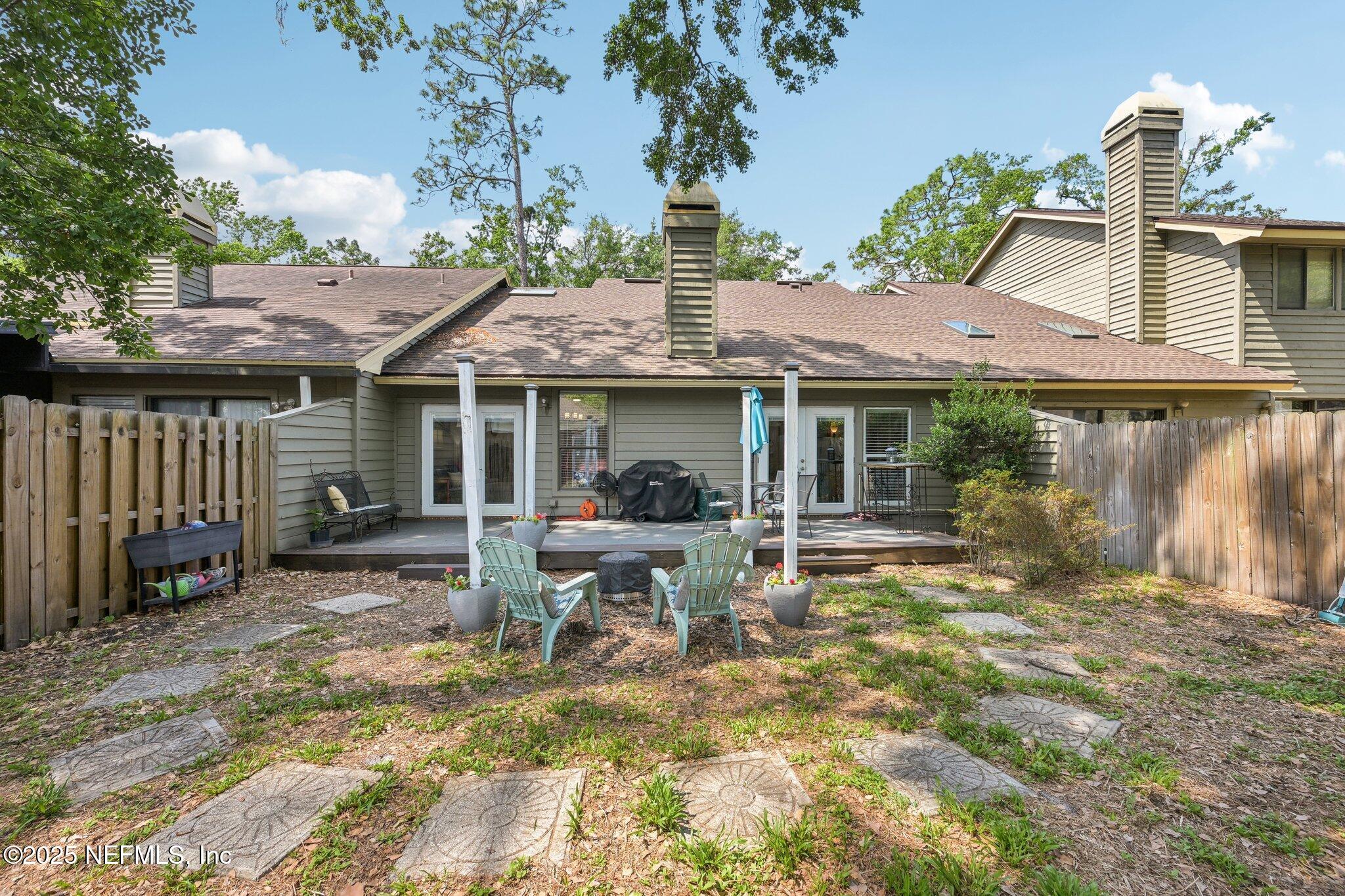 585 Pine Forest Trail Orange Park, FL 32073 - Photo 41 of 52 a view of a house with backyard porch and sitting area