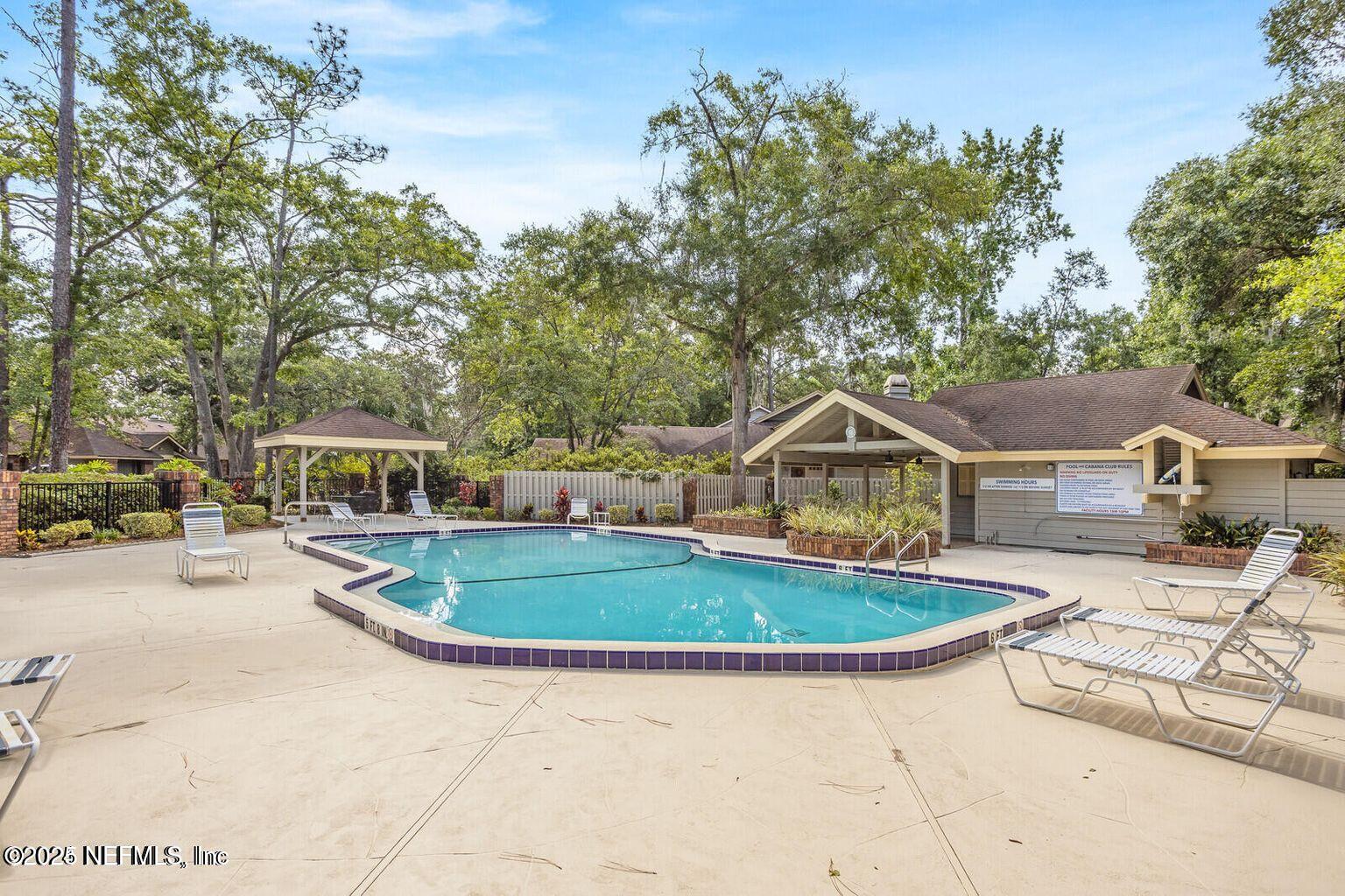 585 Pine Forest Trail Orange Park, FL 32073 - Photo 45 of 52 a front view of house with yard outdoor seating and green space