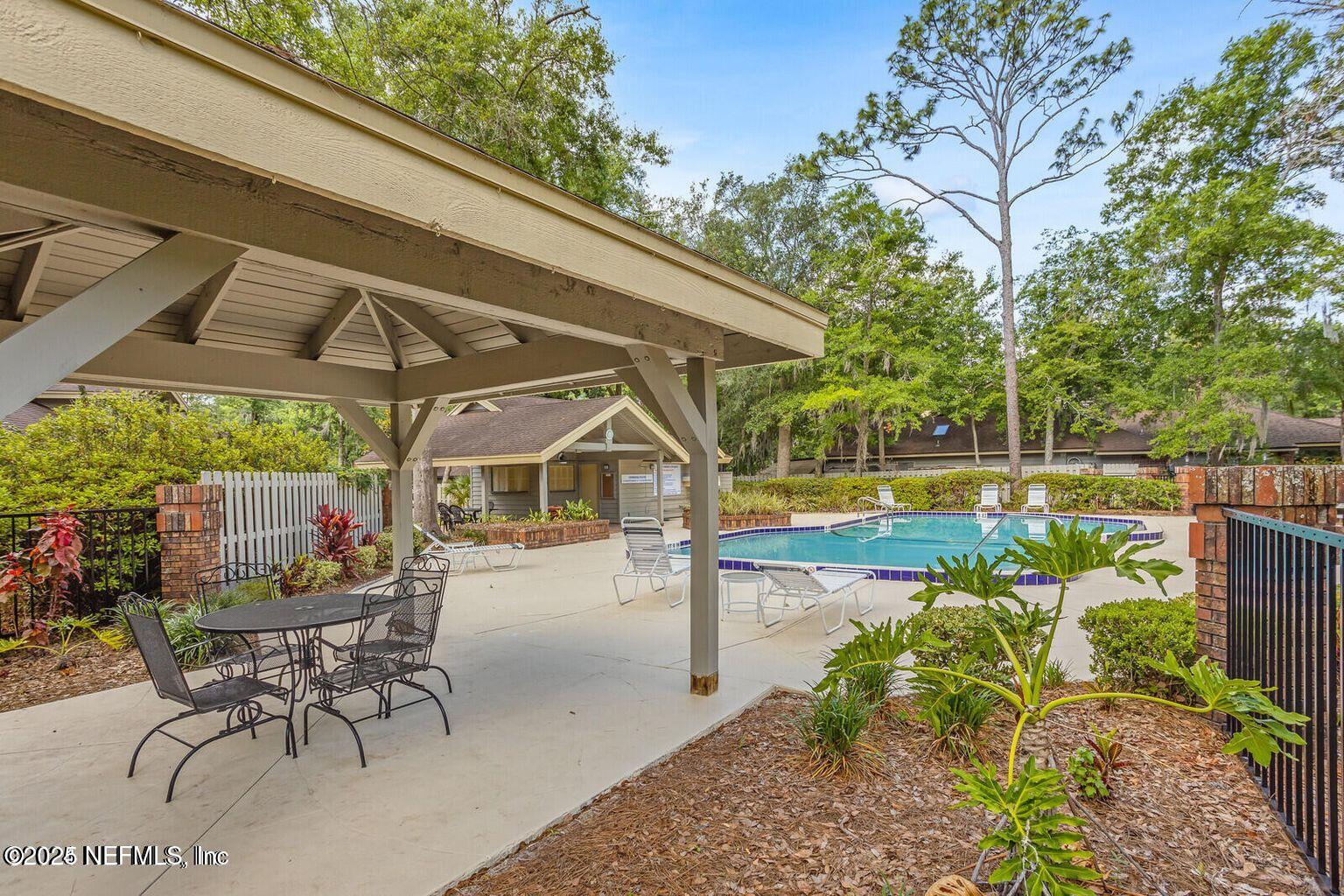 585 Pine Forest Trail Orange Park, FL 32073 - Photo 46 of 52 a patio with table and chairs