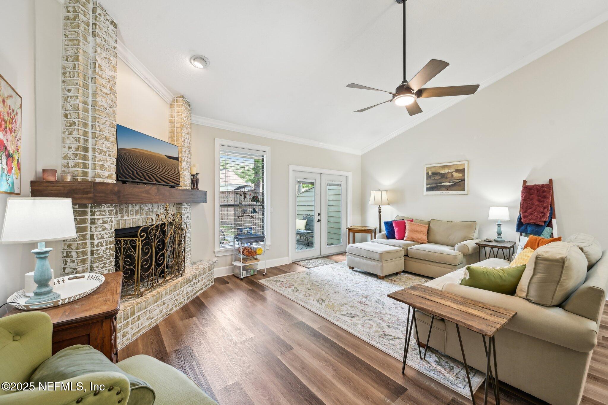 585 Pine Forest Trail Orange Park, FL 32073 - Photo 9 of 52 a living room with furniture fireplace and flat screen tv