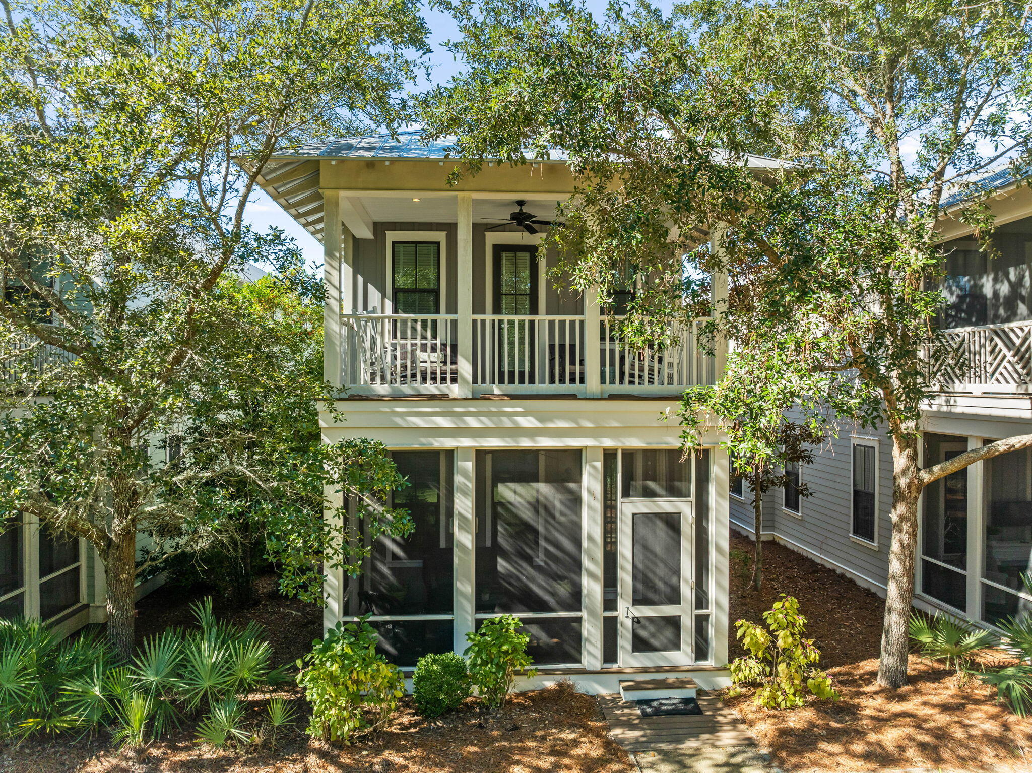 17 Red Basil Drive Santa Rosa Beach, FL 32459 - Photo 1 of 59 a front view of a house with garden