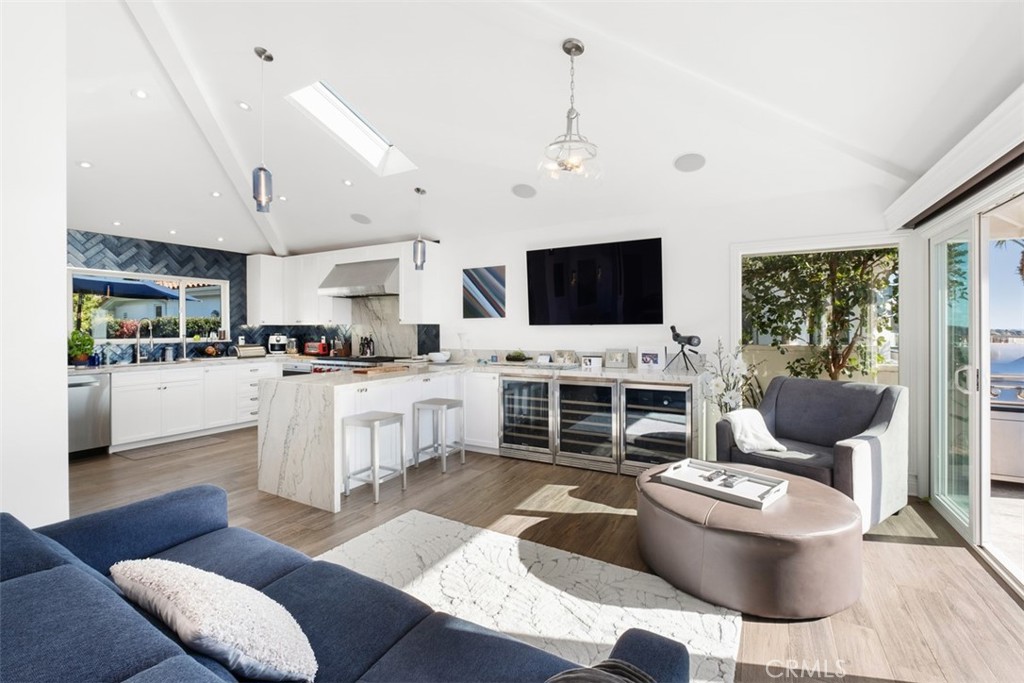 33675 Magellan Dana Point, CA 92629 - Photo 14 of 43 a living room with furniture a fireplace and a flat screen tv