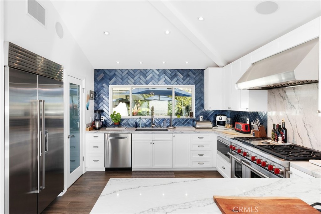 33675 Magellan Dana Point, CA 92629 - Photo 16 of 43 a kitchen with stainless steel appliances a sink and a refrigerator