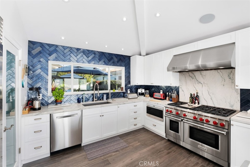 33675 Magellan Dana Point, CA 92629 - Photo 17 of 43 a kitchen with a stove and a sink