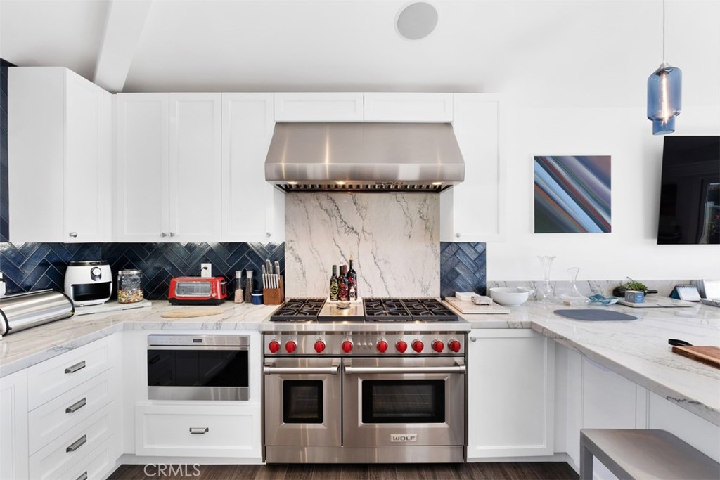 33675 Magellan Dana Point, CA 92629 - Photo 18 of 43 a kitchen with a stove and a sink