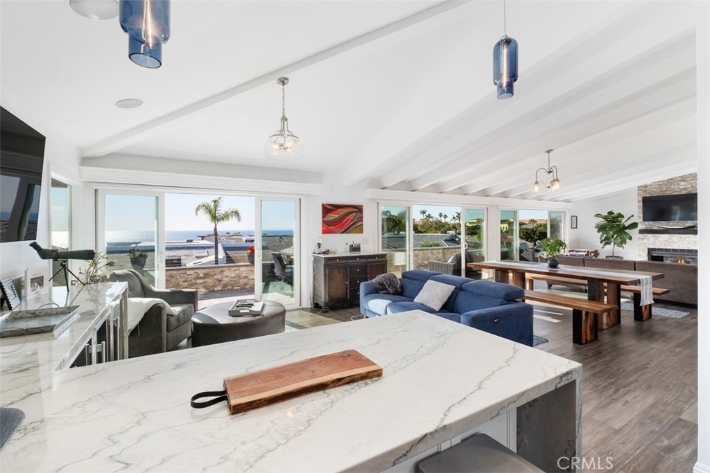 33675 Magellan Dana Point, CA 92629 - Photo 19 of 43 a living room with lots of furniture and kitchen view