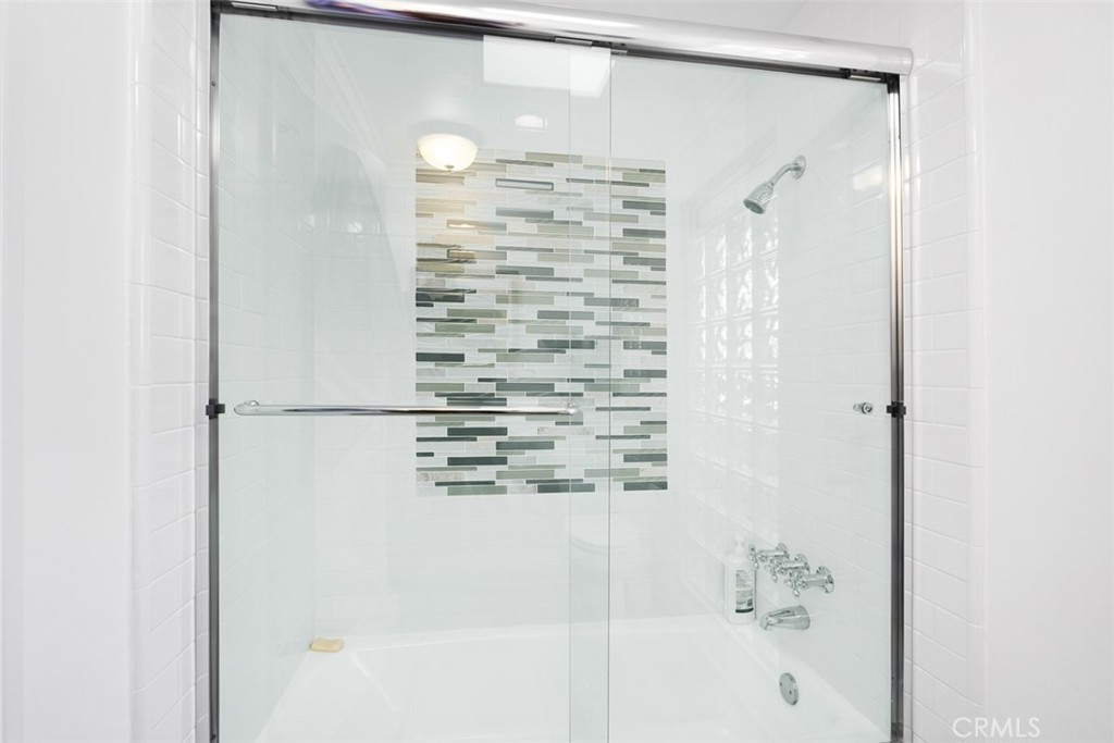 33675 Magellan Dana Point, CA 92629 - Photo 26 of 43 a bathroom with a shower and a bath tub