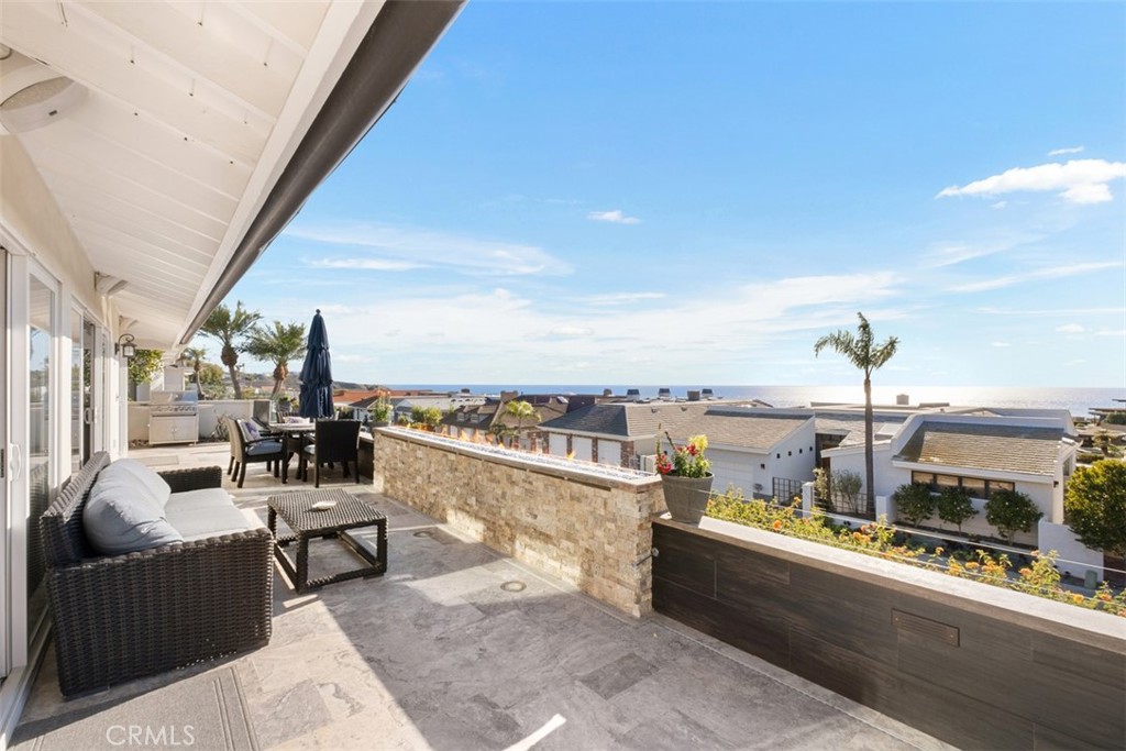 33675 Magellan Dana Point, CA 92629 - Photo 35 of 43 a view of a balcony with couches and city view