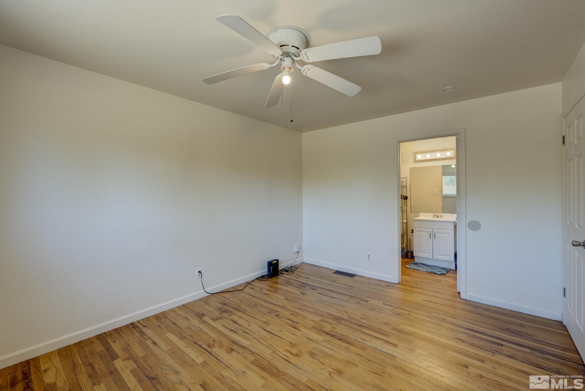1890 Trainer Way Reno, NV 89512 - Photo 12 of 19 wooden floor in an empty room