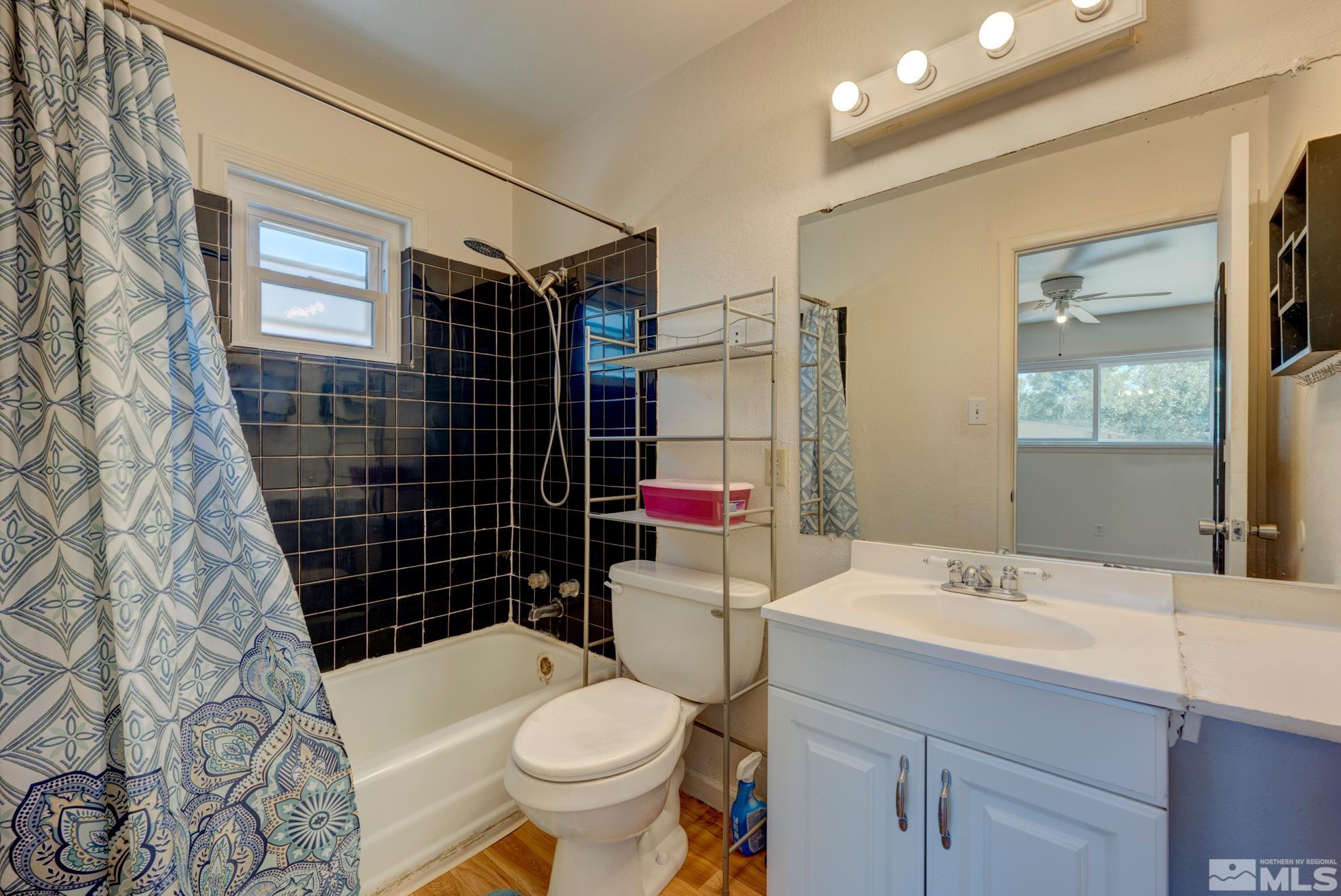 1890 Trainer Way Reno, NV 89512 - Photo 13 of 19 a bathroom with a sink toilet vanity and shower