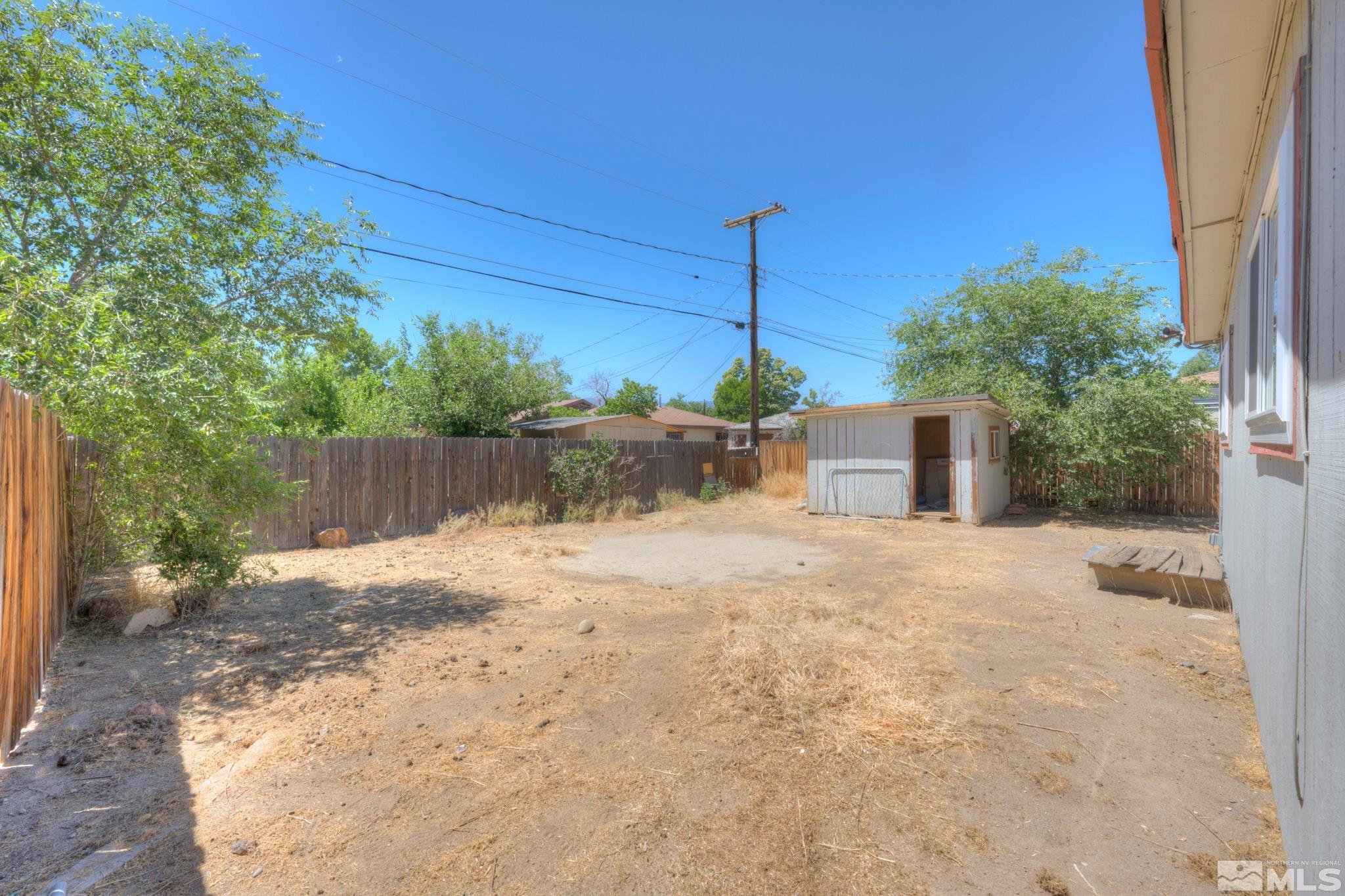 1890 Trainer Way Reno, NV 89512 - Photo 14 of 19 a backyard of a house with a tree