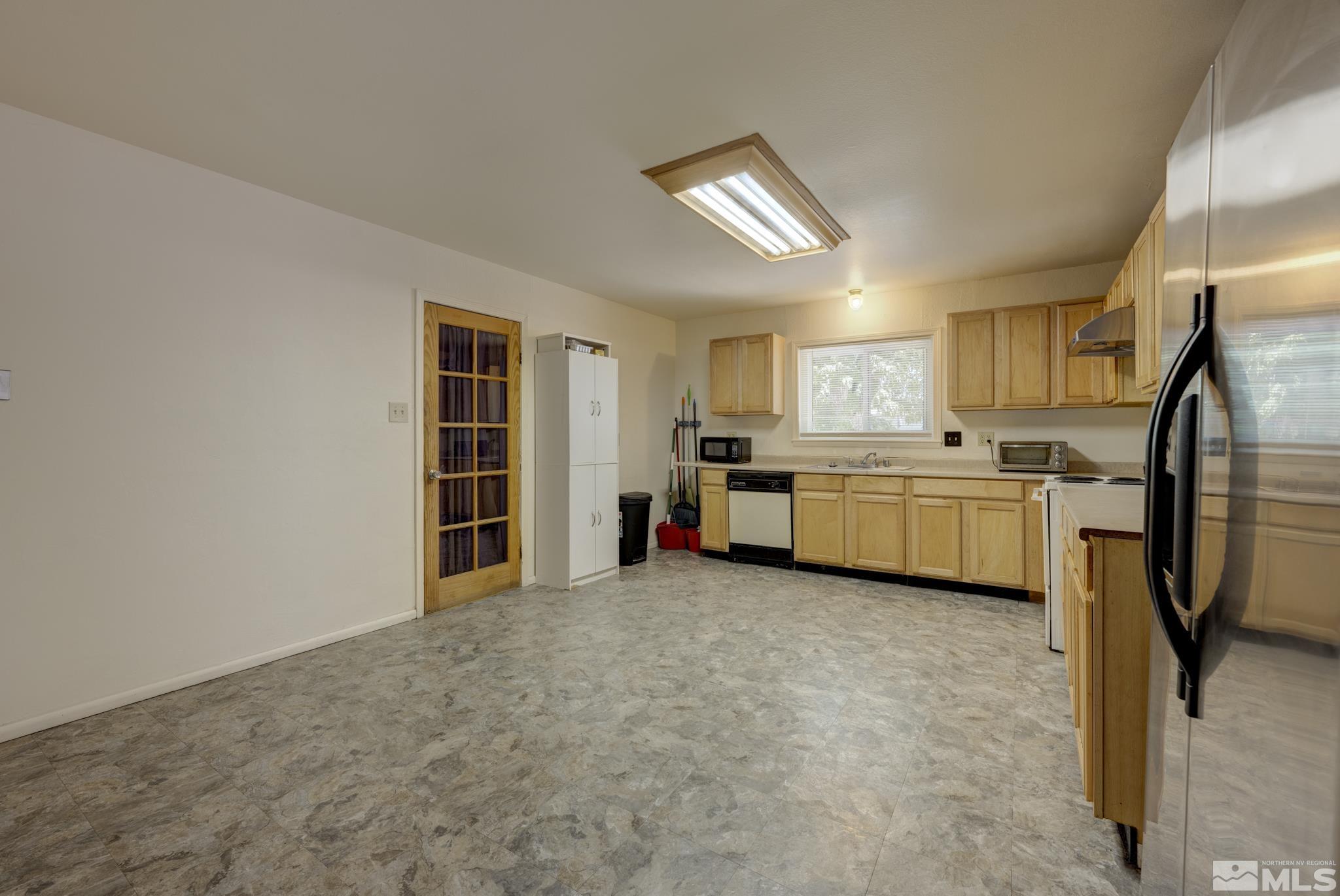 1890 Trainer Way Reno, NV 89512 - Photo 17 of 19 a view of a kitchen with appliances and cabinets