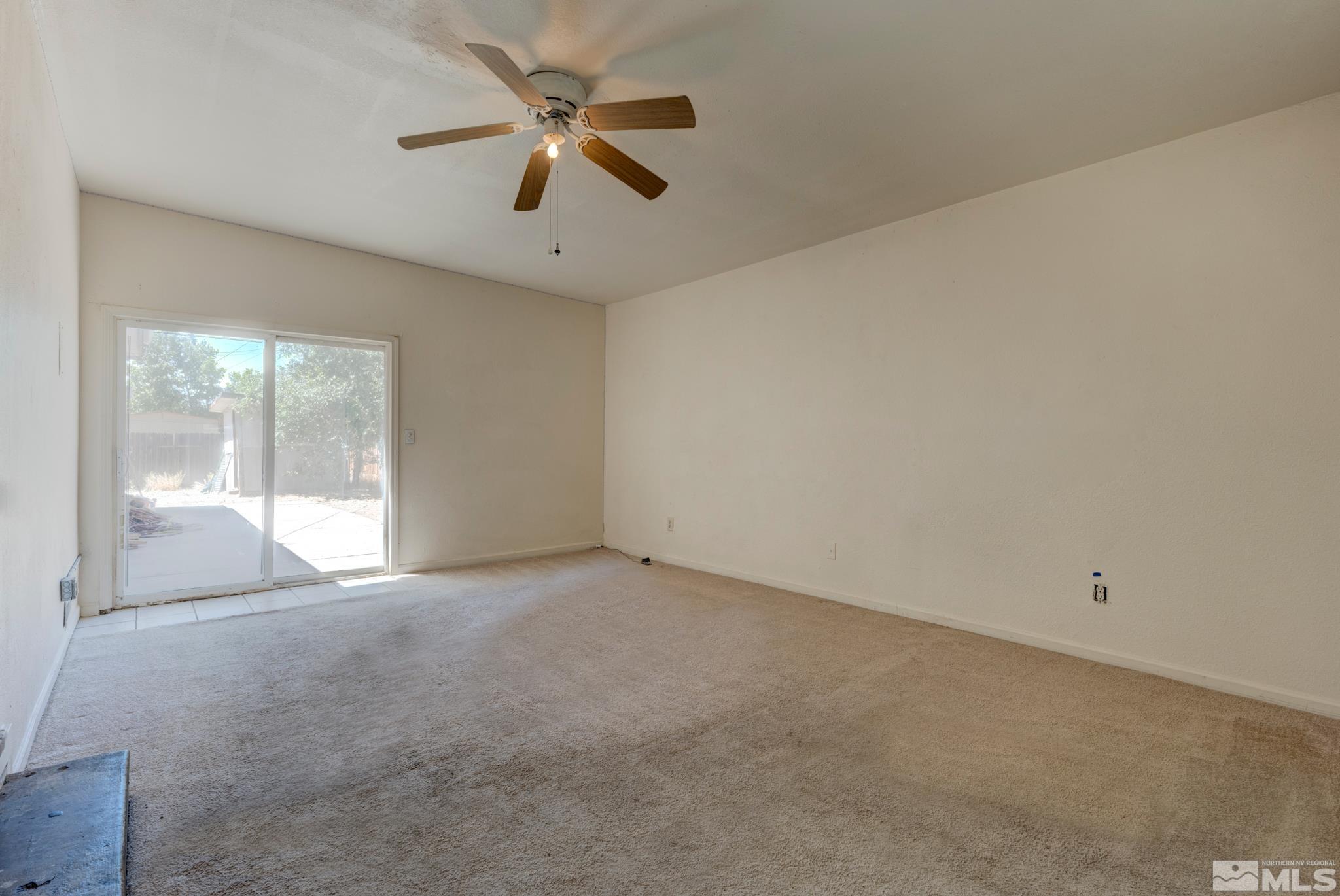 1890 Trainer Way Reno, NV 89512 - Photo 18 of 19 an empty room with a ceiling fan and window
