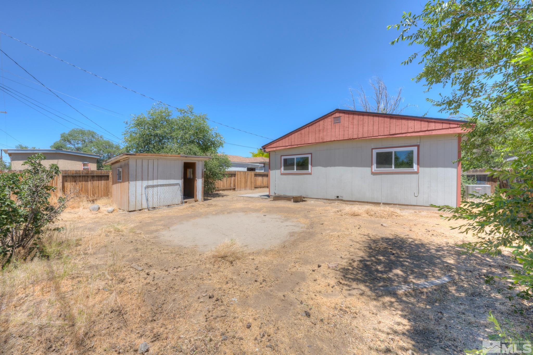 1890 Trainer Way Reno, NV 89512 - Photo 19 of 19 a house with trees in the background