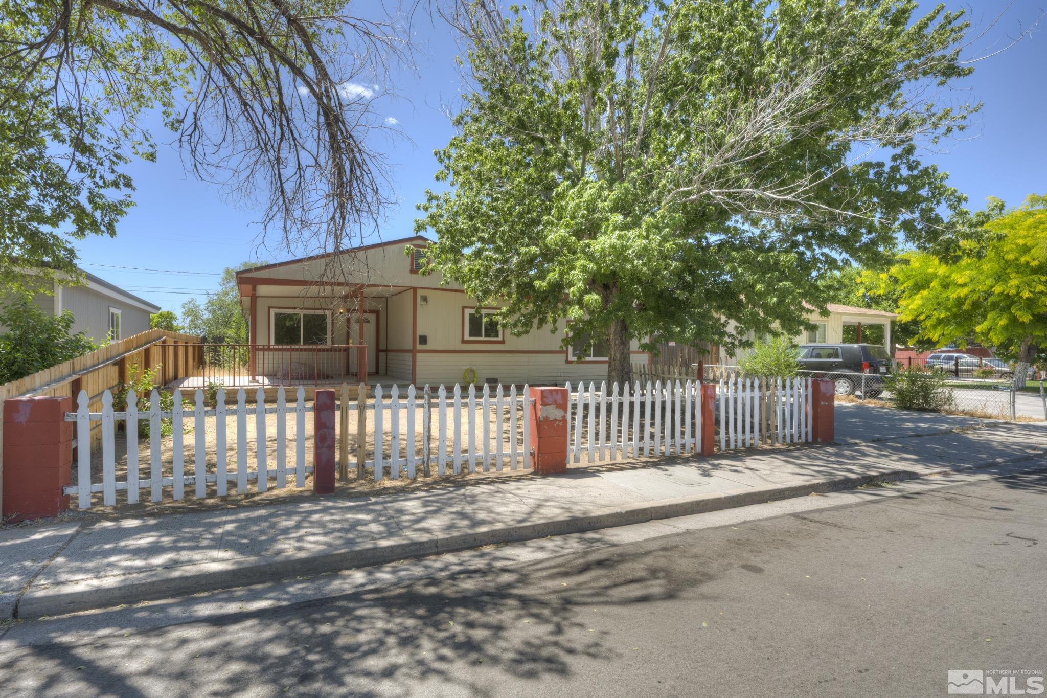 1890 Trainer Way Reno, NV 89512 - Photo 2 of 19 a view of a house with a fence