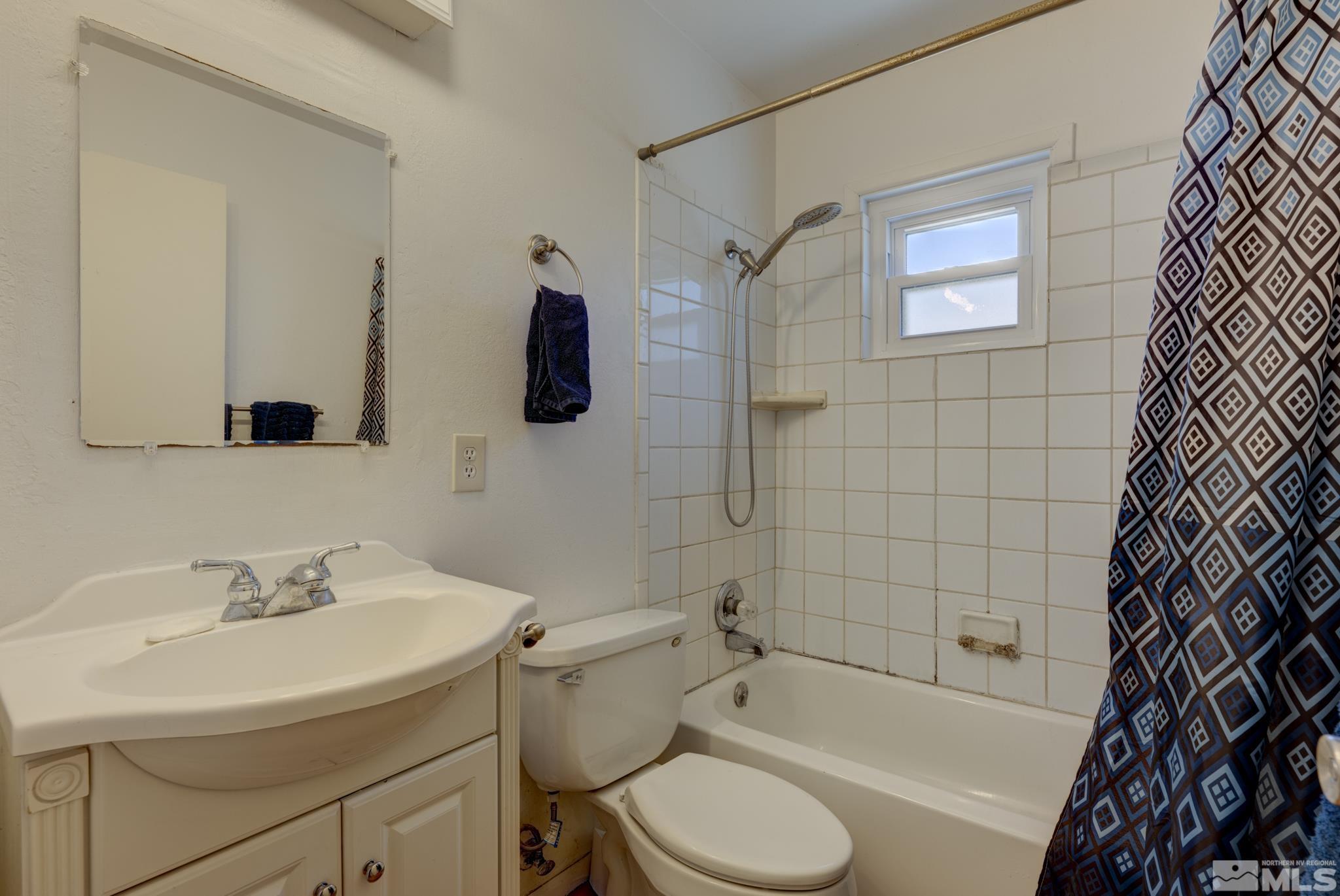 1890 Trainer Way Reno, NV 89512 - Photo 8 of 19 a bathroom with a sink toilet and shower
