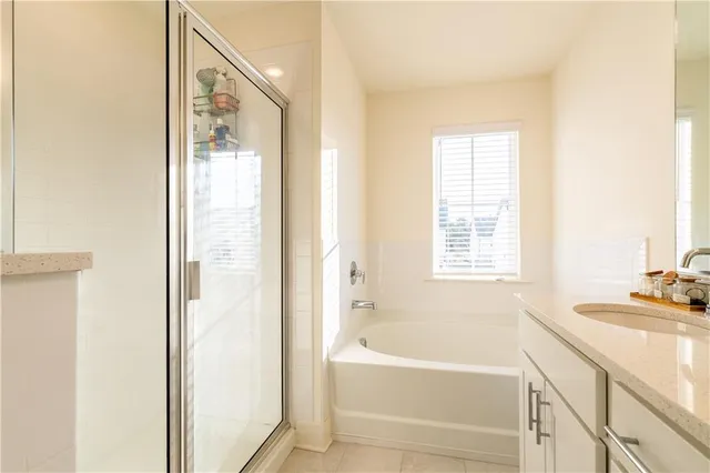 a bathroom with a bathtub and a sink