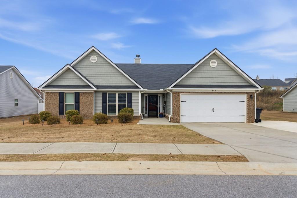 844 River Mist Circle Jefferson, GA 30549 - Photo 1 of 35 a front view of a house with garden