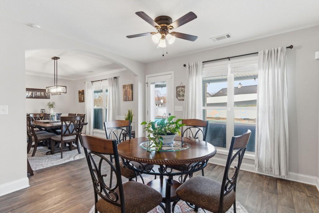 844 River Mist Circle Jefferson, GA 30549 - Photo 14 of 35 a view of a dining room with furniture and wooden floor