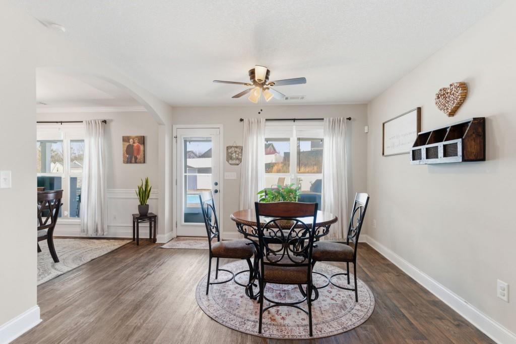 844 River Mist Circle Jefferson, GA 30549 - Photo 15 of 35 a view of a dining room with furniture and wooden floor